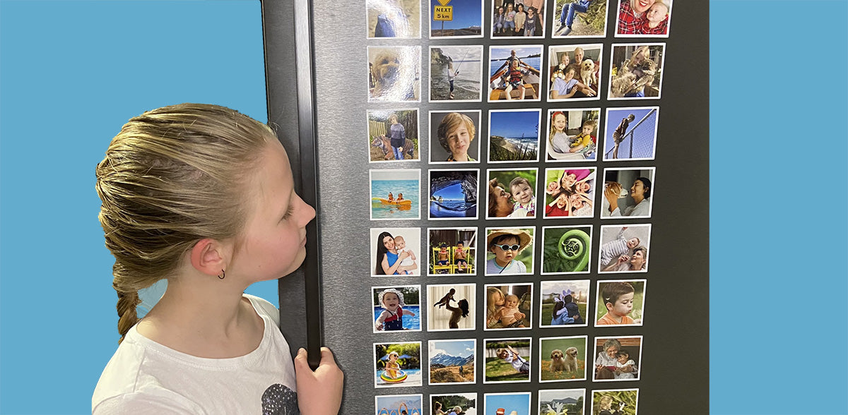 Full fridge of Photo Magnets with young girl looking at them