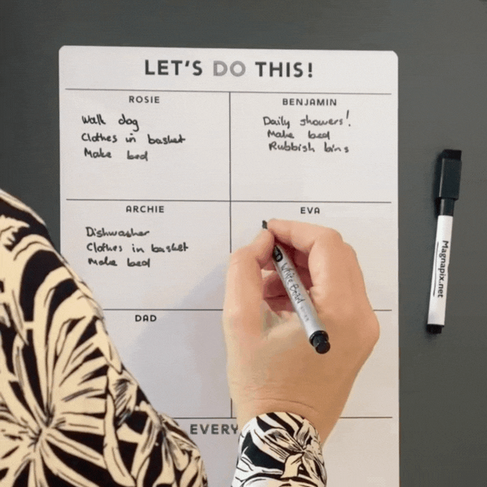 Magnetic planner being filled out fridge