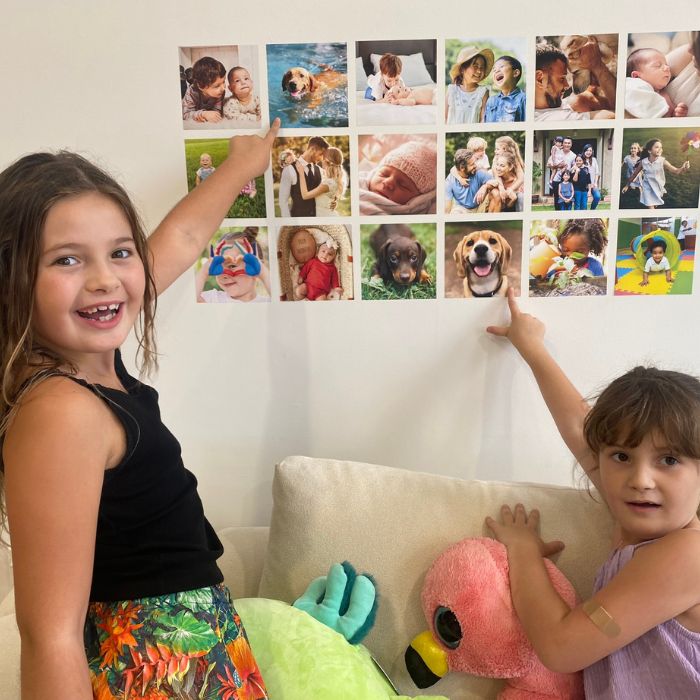 removable photo decals on wall above couch